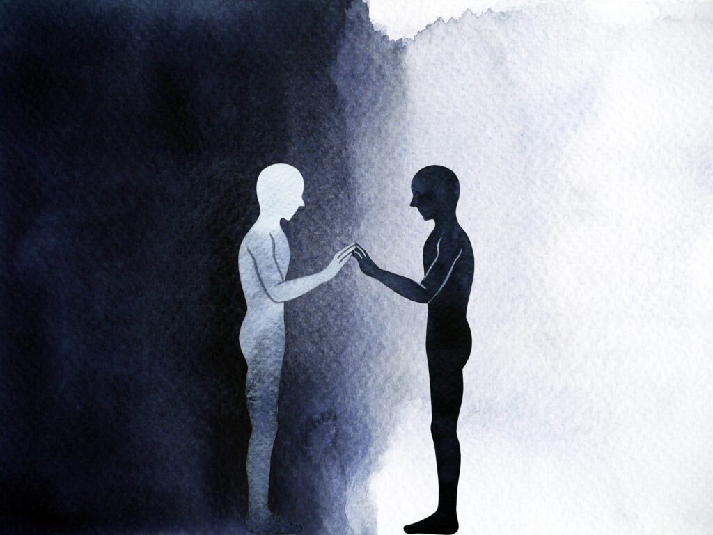 représentation de deux personnes face à face et debout avec une aura noire et une aura blanche.
